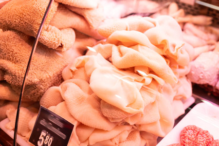 Raw lamb stomachs on store counterの写真素材