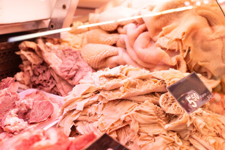 Raw cow tripe on counter of butcher shopの写真素材