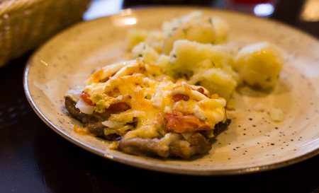 French meat with boiled potatoes served on plateの写真素材