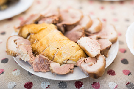 set of cold cuts of cooked chicken and pork meat on plateの写真素材