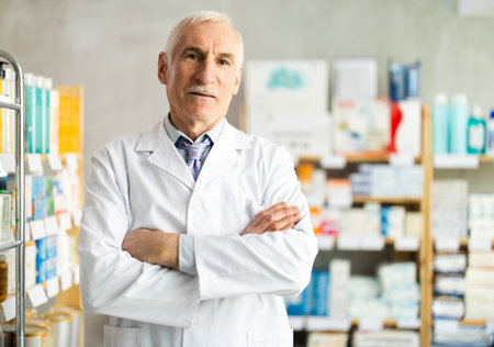 Male pharmacist invites to pharmacyの写真素材