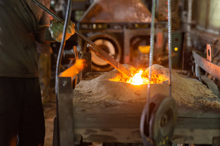 Ferrous metal billet is melted in an induction furnace closeupの写真素材
