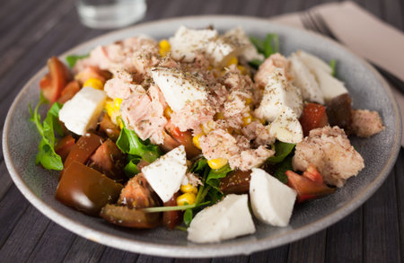Closeup of salad with fish and vegetables for lunchの写真素材