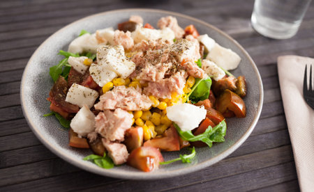 Closeup of salad with fish and vegetables for lunchの写真素材