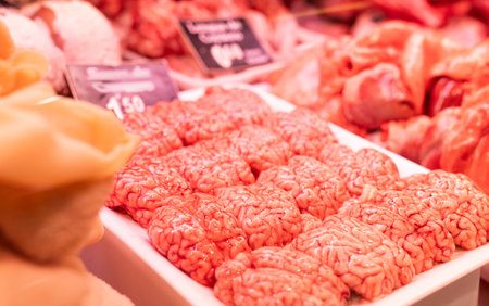 Raw sheep brains on counter of butcher shopの写真素材