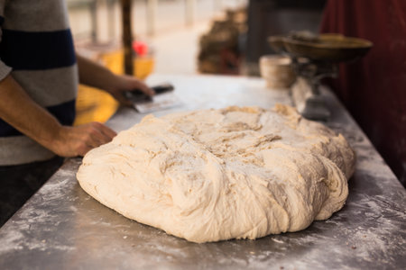 mass of yeast dough in the bakeryの写真素材