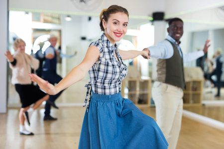 Pair dancing lindy hop during rehearsal