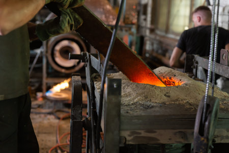 Foundry - ferrous metal is melted in an induction furnace of metallurgical plant