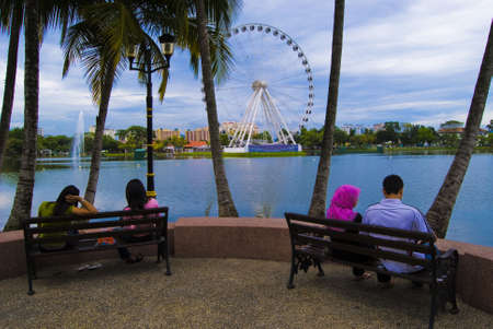 People watching Eye On Malaysia at  Lake Titiwangsa, Kuala Lumpur, Malaysiaの写真素材