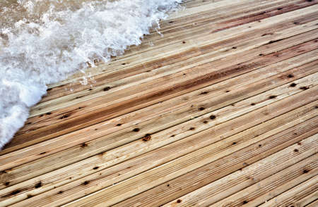 wave on a wooden dock