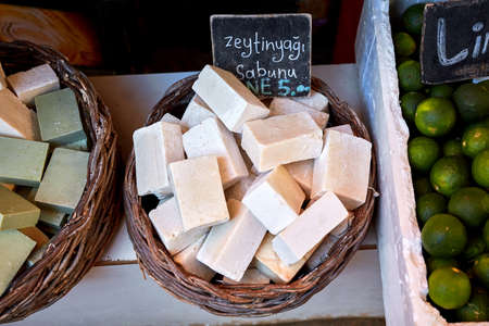 Handmade authentic olive oil soaps in a baskes on the counter of a Turkish bazaar