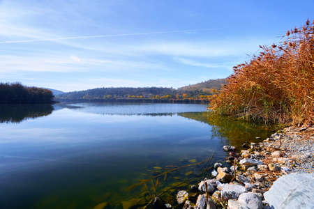 Tranquil view of Eymir lake including sky, reed, stones and blue water in early morning sunrise