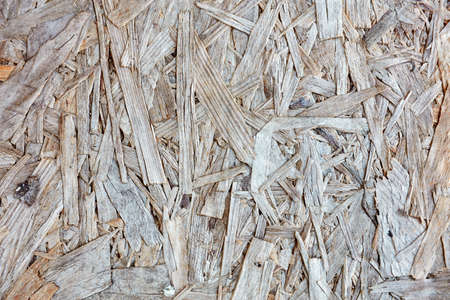 Textured wooden chipboard and plywood. Close up background backdrop view.