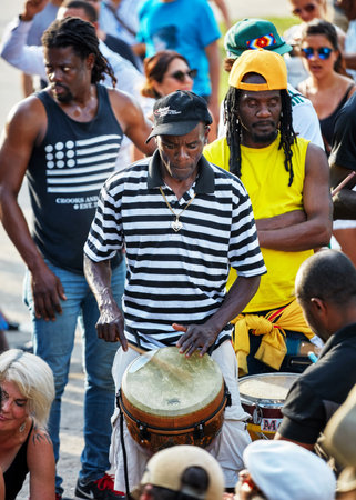 Montreal, Canada - June, 2018. African American male percussionist plays djembe drum bongo at Tam Tams festival in Mount Royal Park, Montreal, Quebec, Canada. Editorial use.のeditorial素材