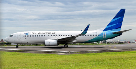 Garuda Indonesia, PK-GMD, Boeing 737-800, lining up runway 08 of Adi Soemarmo Airport for takeoff (Indonesia, November 18, 2017)のeditorial素材