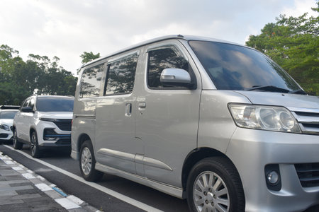 Silver van parked on the parking space.の写真素材