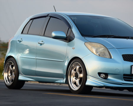Blue car on the road. Side view of a blue car.の写真素材