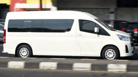 White van on the street. Blurred motion.の写真素材