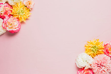 Flowers composition. Frame made of flowers on pink background. Flat lay, top view, copy space