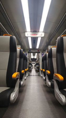 Interior of a train with seats in a row on the platformの写真素材