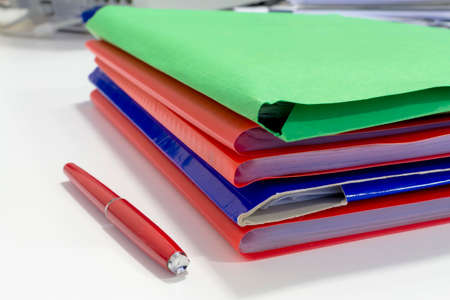 Stack of folders with archival documents in the office