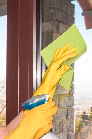 woman who washes the windows of the houseの写真素材