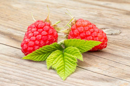 close-up of raspberries on a wooden backgroundの写真素材