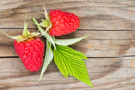 close-up of raspberries on a wooden backgroundの写真素材