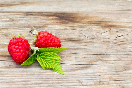 close-up of raspberries on a wooden backgroundの写真素材