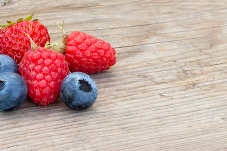 close-up of berries on a wooden backgroundの写真素材