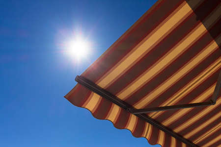 Sun shade  with blue sky in the backgroundの写真素材