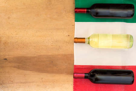 Italian wine bottles on wooden backgroundの写真素材