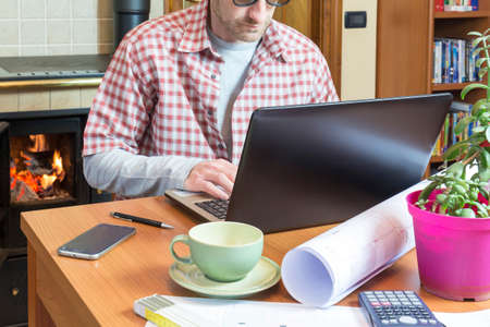 Young man works remotely through internet connectionの写真素材