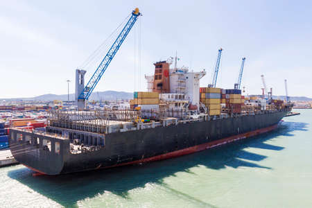 Cargo ship moored at the harborの写真素材