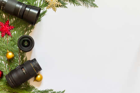 Lenses for reflex camera and Christmas decorations on a white  backgroundの写真素材