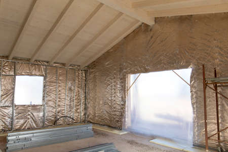 Building construction: insulation of a house with thermal reflective materialの写真素材