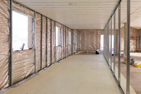 Building construction: insulation of a house with thermal reflective materialの写真素材