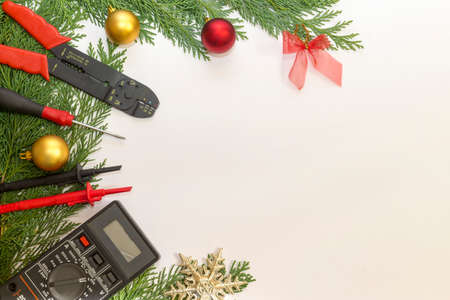 Electrician tools and instruments  and Christmas decorations on white backgroundの写真素材