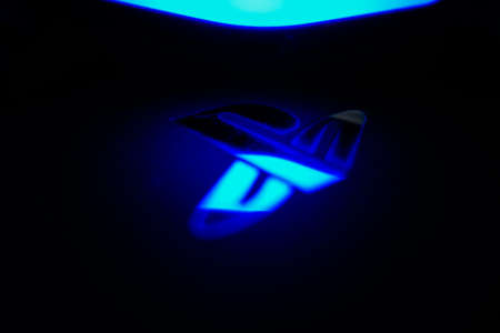 Sony Playstation logo illuminated on blue light from game controllerのeditorial素材