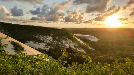amazing sunset on an environmental Protection area, with dunes and forestの写真素材