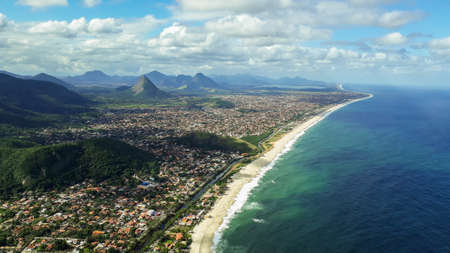 Panoramic view of the coastal city of Marica, Rio de Janeiro, Brazil, facing the Atlantic Ocean. Brazilian coast and sea. from the lookout on the elephant rock, or pedra do elefanteの写真素材