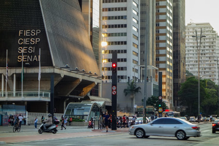famous Paulista avenue in Sao Paulo city, at sunset. buildings and traffic in the financial center