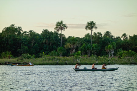 fishermen sailing on tropical Preguica river in Barreirinhas, Brazilのeditorial素材