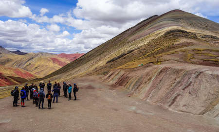 tourists on Palccoyo rainbow mountains, in Cusco, Peru. Colorful landscape in the Andesのeditorial素材