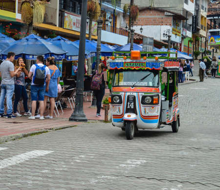 tuc tuc transport on streets of Guatape, Colombia. cityscapeのeditorial素材