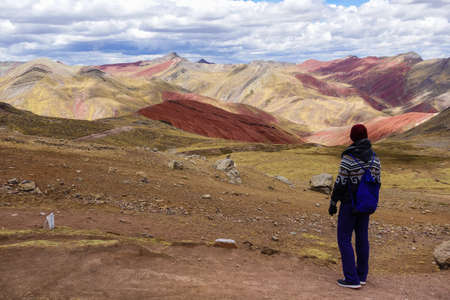 trekker on Palccoyo rainbow mountains, in Cusco, Peru. Colorful landscape in the Andesの写真素材