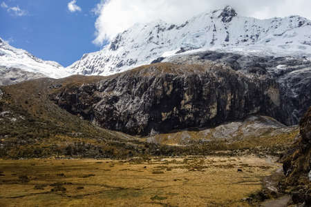 Trekker on the trail to Lagoon 69, on the valley of Huascaran mountains on Huaraz, Peruvian Andes