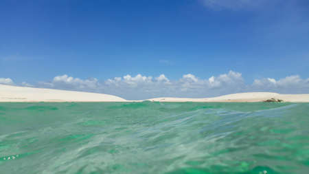 paradisiacal concept, rest and relaxation, tropical summer, blue water and white sand.