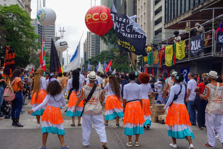Sao Paulo, Brazil - Nov.20.2021: musicians perform samba in rally against Brazilian president...