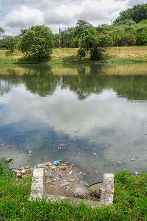 Sewage and trash on water of city river. Pollution concept, ecosystem and environmental. high quality photoの写真素材